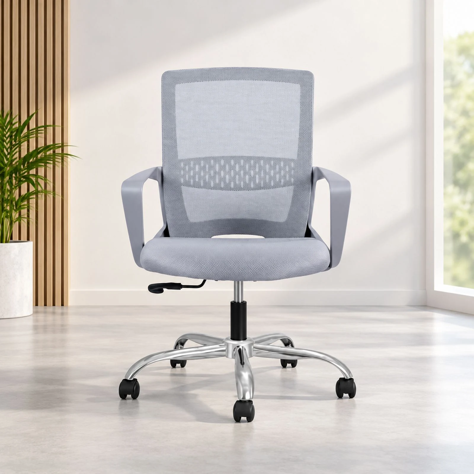 A grey mesh task chair